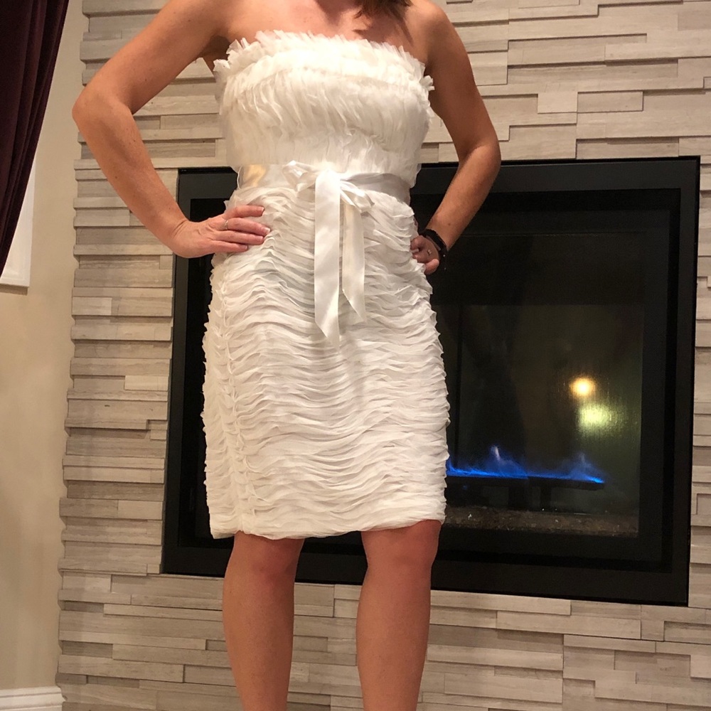 Elegant white dress for special occasions.